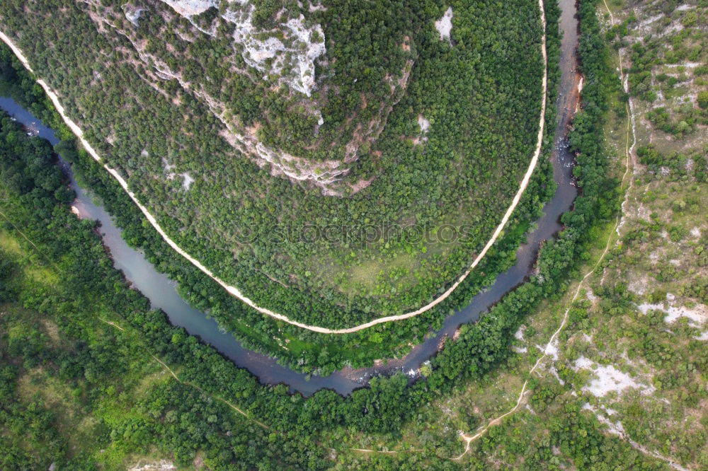 Similar – Aerial view of a road along the river