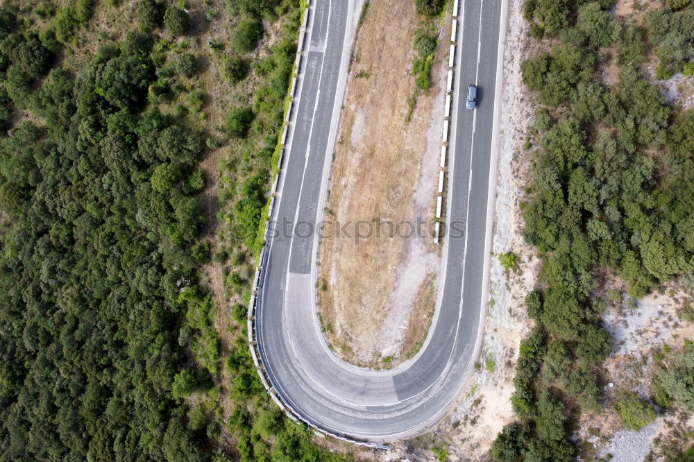 Similar – Aerial view of a road along the river