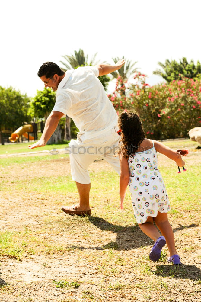 Similar – Mother holding walking child