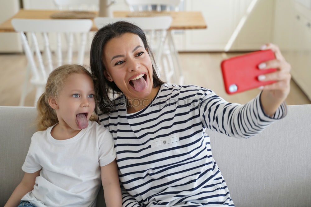 Similar – happy mother and toddler son using tablet