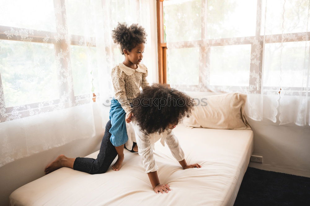 Similar – Image, Stock Photo afrcian girl giving teddy sweets at home