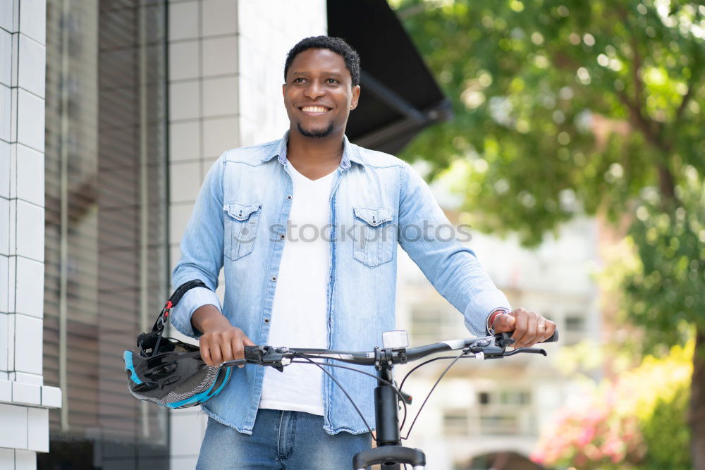 Similar – Young black man walking smiling down the street.