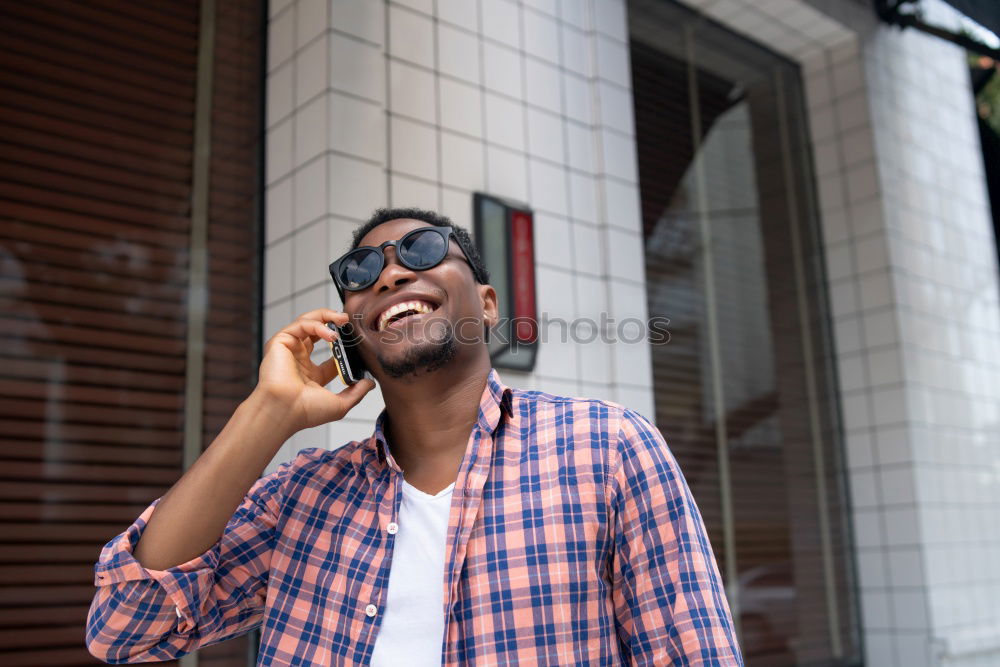 Similar – Afro young man using mobile phone and fixed gear bicycle.