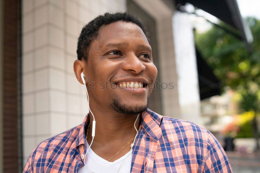 Similar – Image, Stock Photo Young black man wearing casual clothes walking smiling down the street