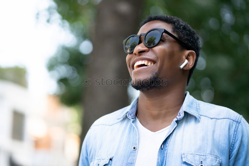 Similar – Afro young man using mobile phone and fixed gear bicycle.