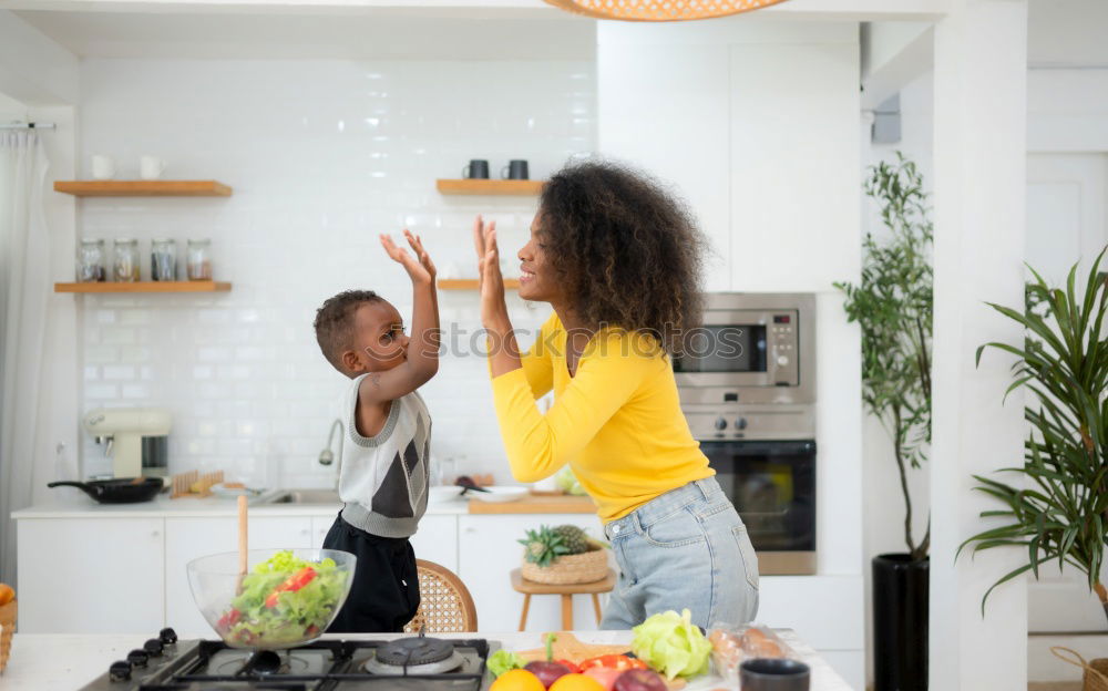 Similar – Image, Stock Photo little african girl is helping her mum preparing cupcake dough