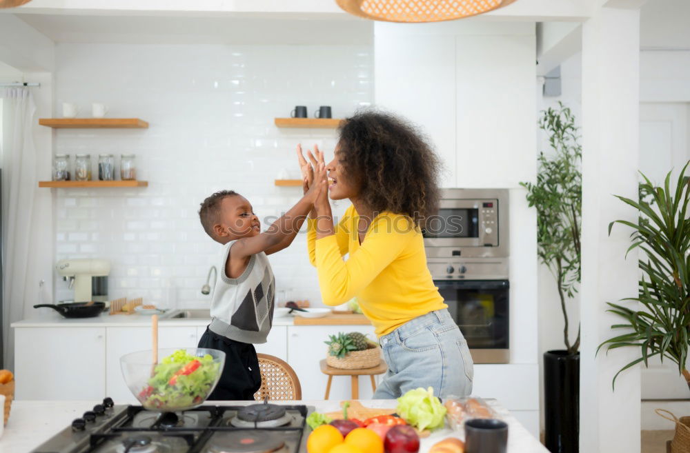 Similar – Image, Stock Photo little african girl is helping her mum preparing cupcake dough