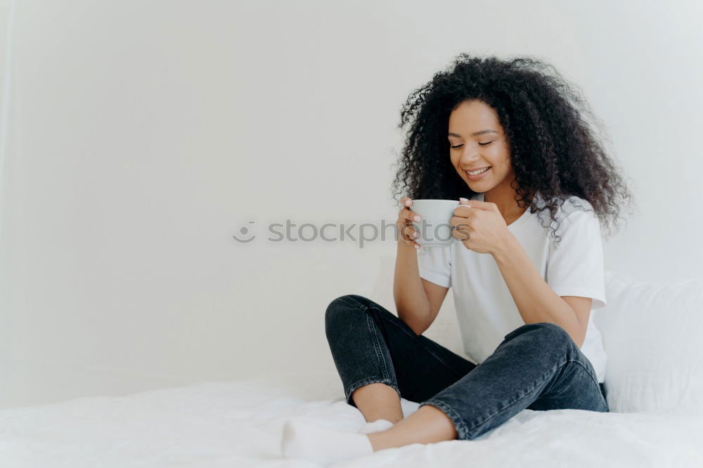 Similar – Pretty black woman covering her mouth with the sheet looking away