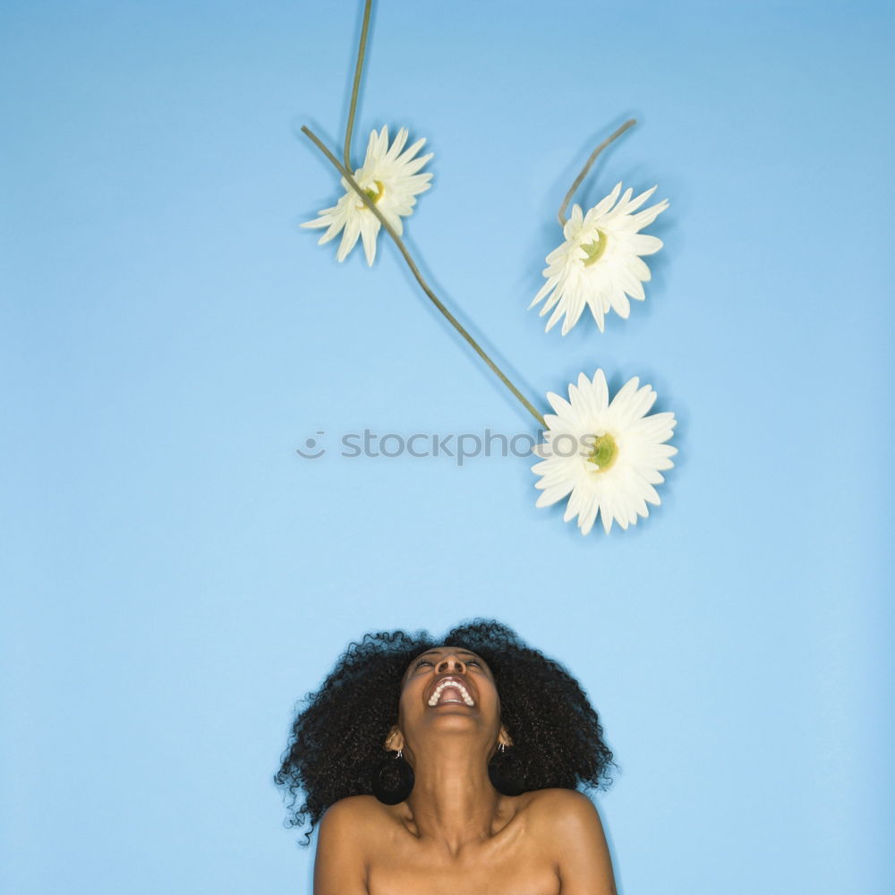 Similar – Happy young black woman surrounded by flowers