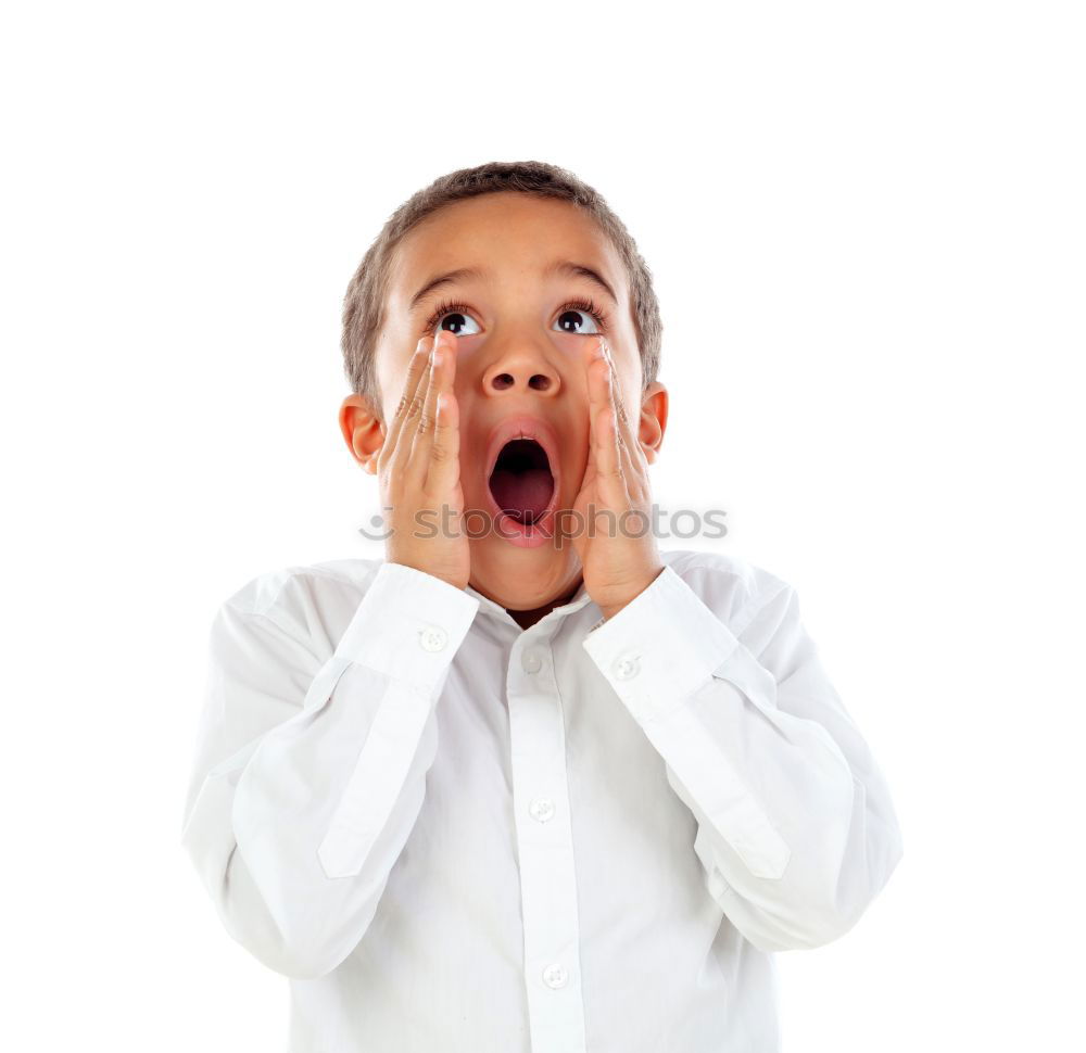 Amazed boy in light studio