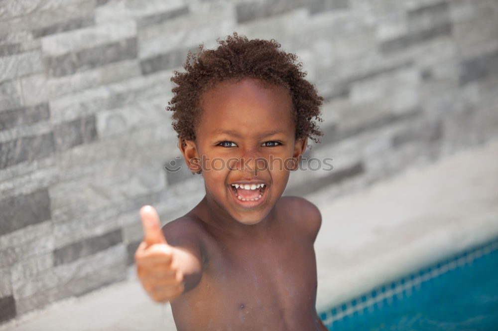 Similar – Black father feeds his son a kiwi