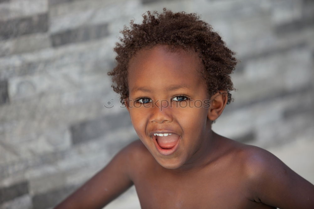 Similar – Black father feeds his son a kiwi