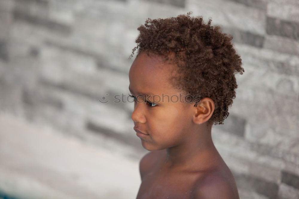 Similar – Black father feeds his son a kiwi