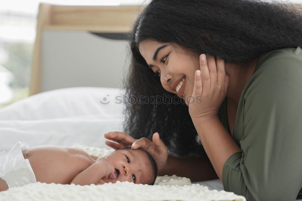 Similar – Image, Stock Photo African american mother giving daughter a kiss on cheek