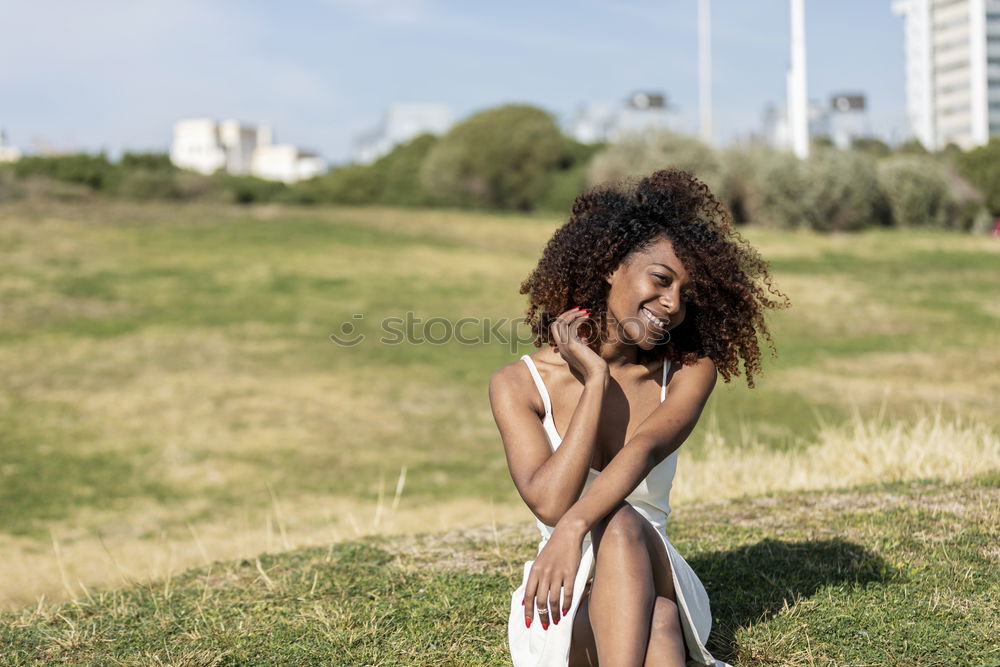 Similar – Image, Stock Photo Beautiful young black woman lying down in a  wooden foot bridge at the beach