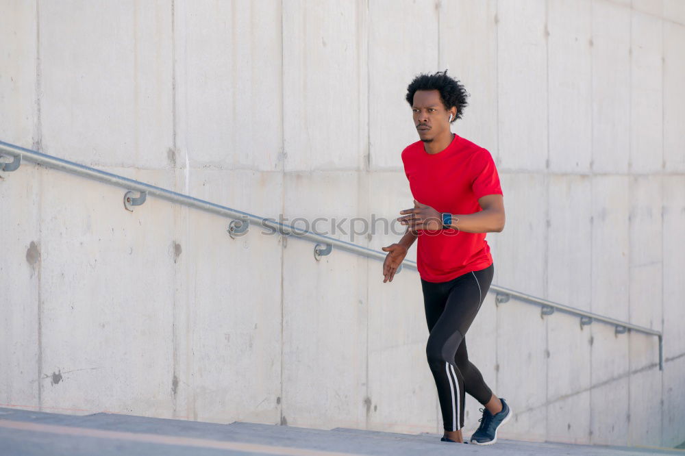 Similar – Young sports man is running up the stairs for his workout