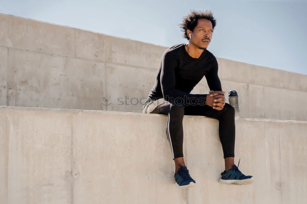 Similar – Image, Stock Photo Black man doing stretching after running outdoors