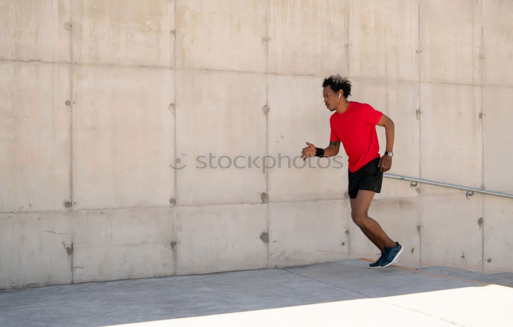 Similar – Young sports man is running up the stairs for his workout