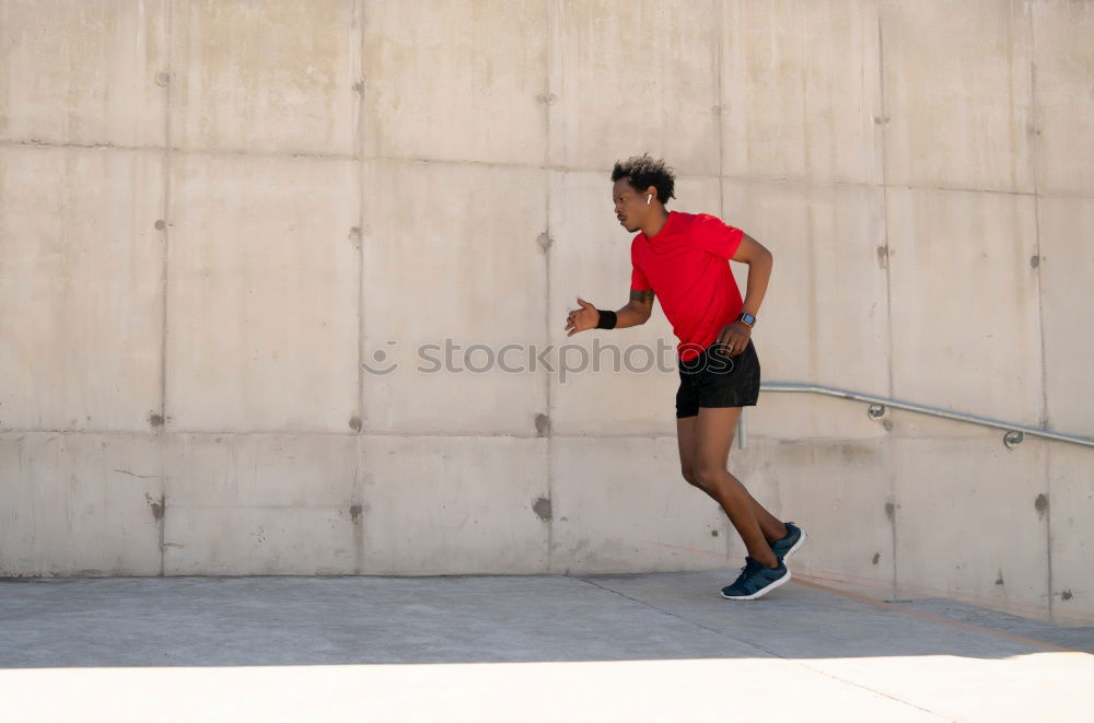 Similar – Young sports man is running up the stairs for his workout