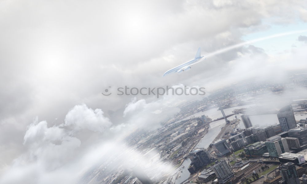 Similar – MÖVEN + HAUS + LATERNE + KONDENZSTREIFEN + WOLKEN + HIMMEL