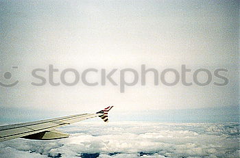 Similar – clouded view Wing Airplane