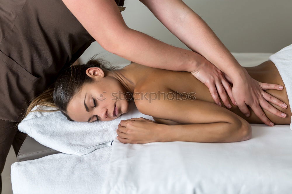 Similar – Image, Stock Photo Woman receiving back massage on clinical center