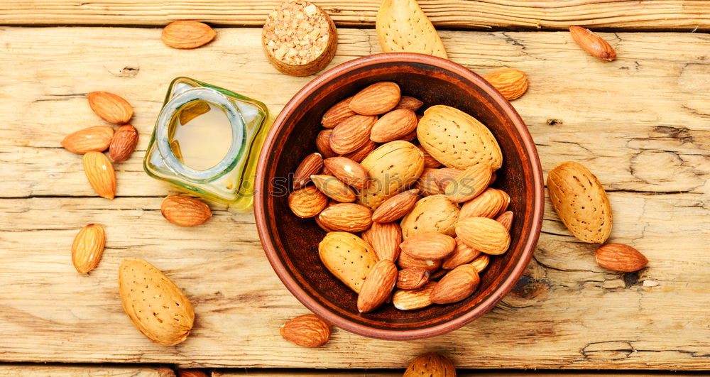 Image, Stock Photo Almond oil in bottle and nuts