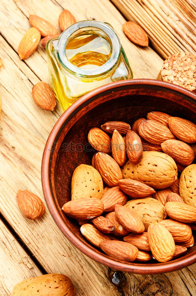 Similar – Image, Stock Photo Almond oil in bottle and nuts