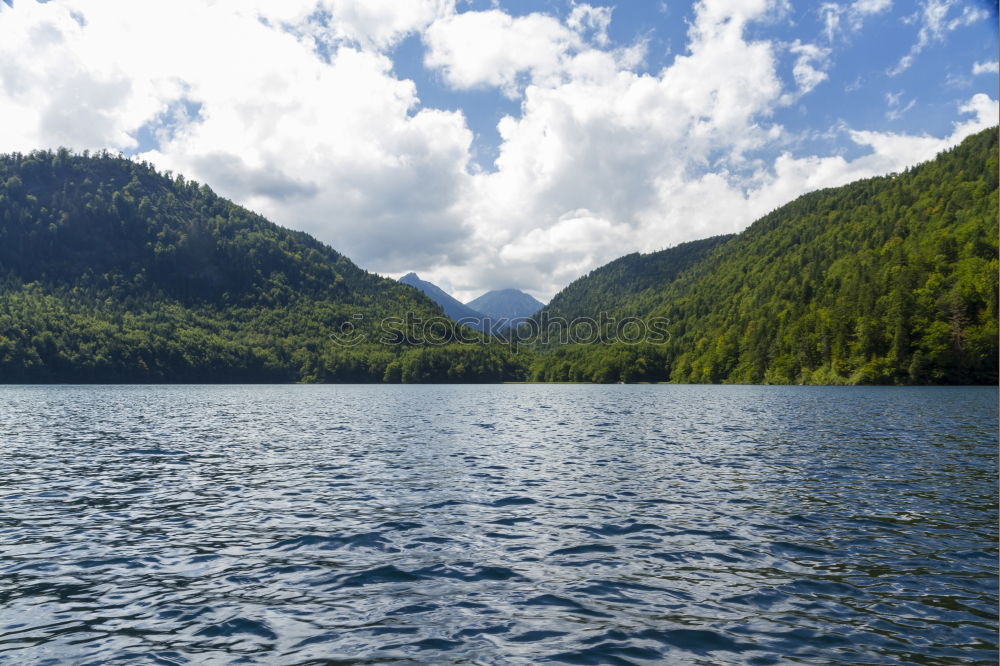 Similar – Calm river flowing between green hills