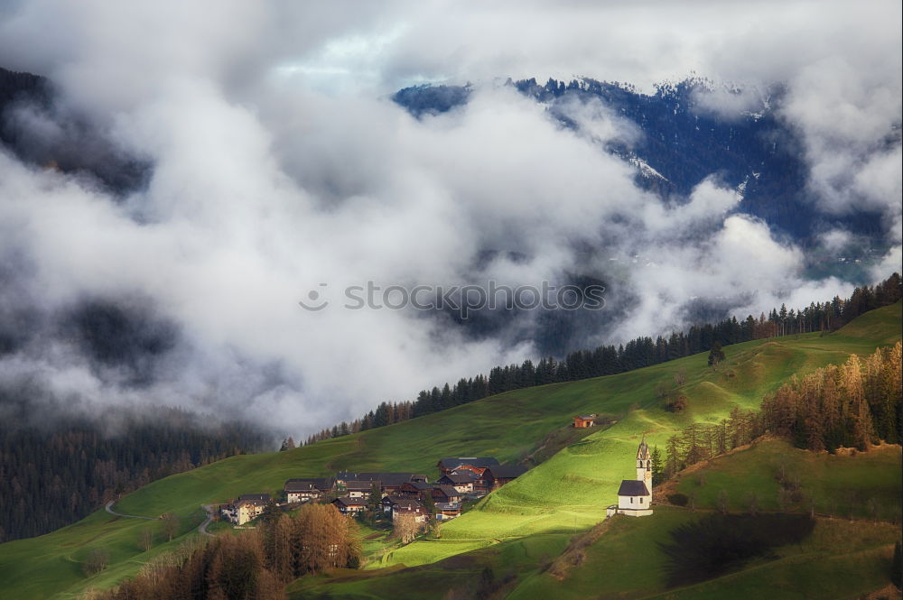 Similar – Mountains village on hillsides. Lone house on green hills