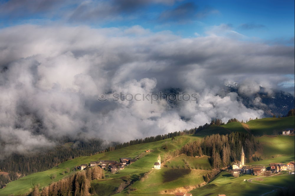 Similar – Mountains village on hillsides. Lone house on green hills