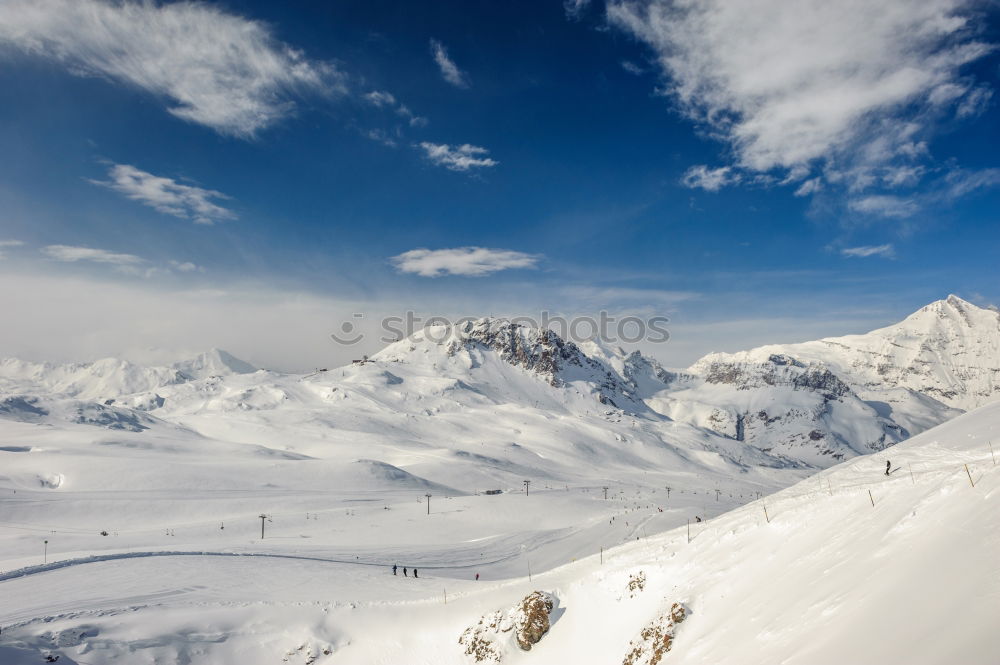 Similar – Image, Stock Photo Snowy blue mountains in clouds at sunset