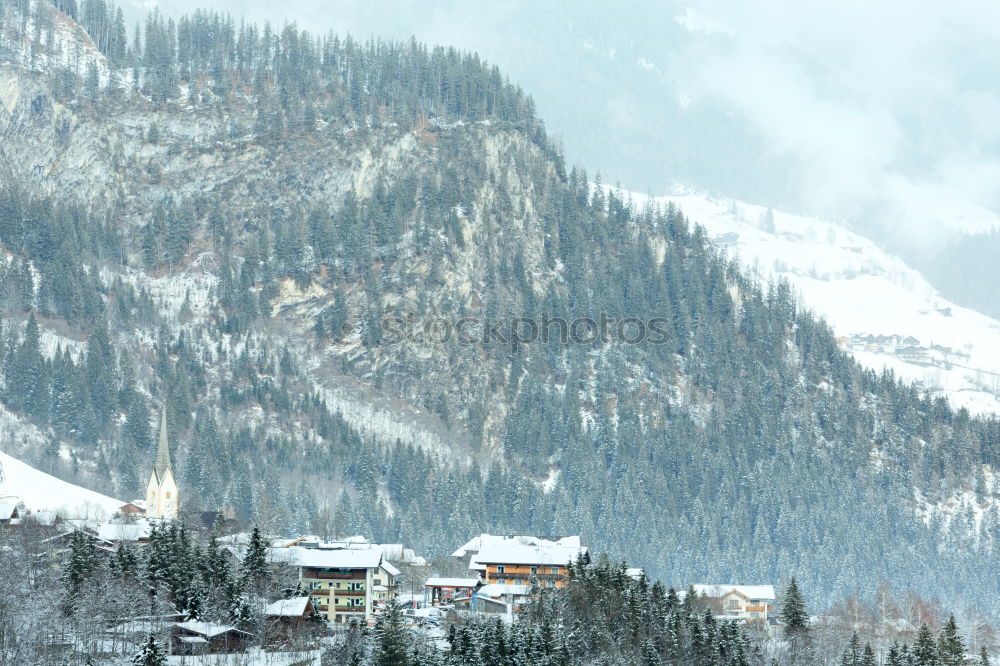 Similar – Snowfall over Austrian mountain village