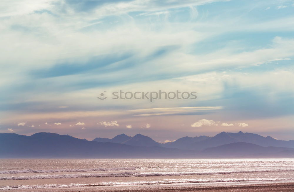 Image, Stock Photo Endless beach at Rainbow Beach. Walk left at the beach. A car is approaching. In the background a medium high mountain.