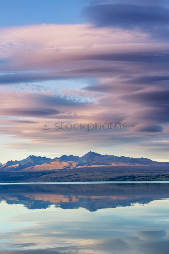 Song Kul lake with horses in sunrise