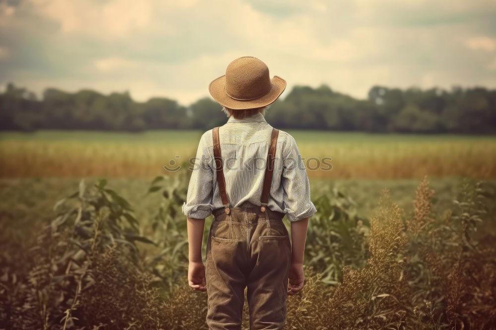 Similar – boy running through the field with balloons