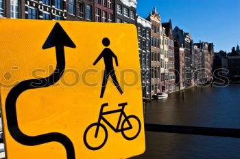 Similar – Signs I In front of a yellow house on the left and right side of the road there are traffic signs