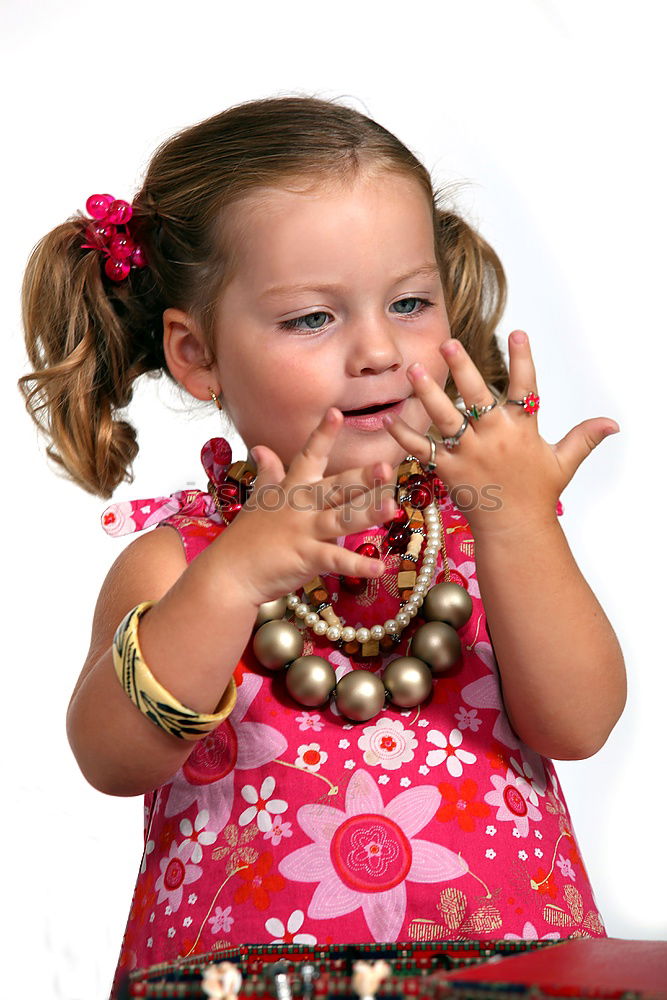 Similar – Little girl enjoying her role of princess. Adorable cute 5-6 years old girl wearing pink princess dress and crown