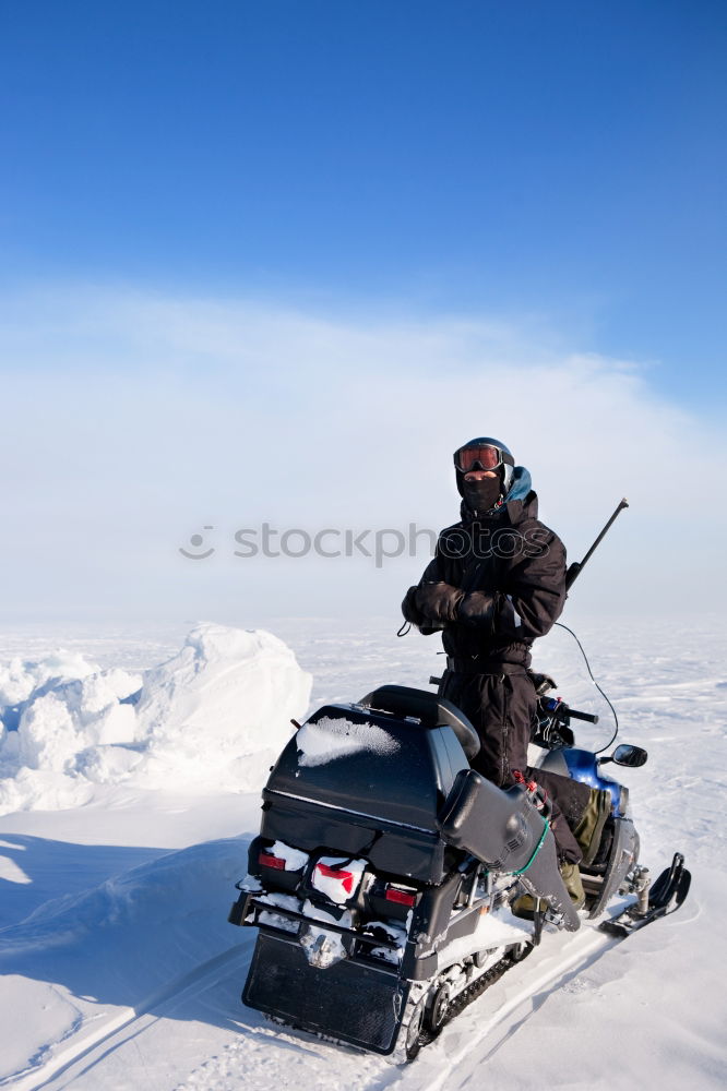 Image, Stock Photo Man with motorcycle in snowy highlands