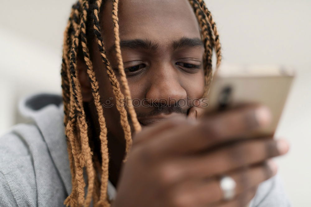 Similar – Image, Stock Photo Young black man using smart phone outdoors