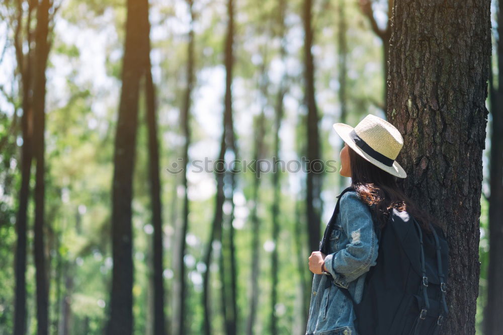 Similar – Woman hanging out of car in forest