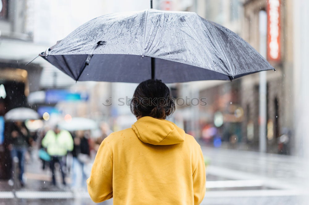 Similar – Image, Stock Photo Little girl holding big umbrella walking in a downtown on rainy gloomy autumn day