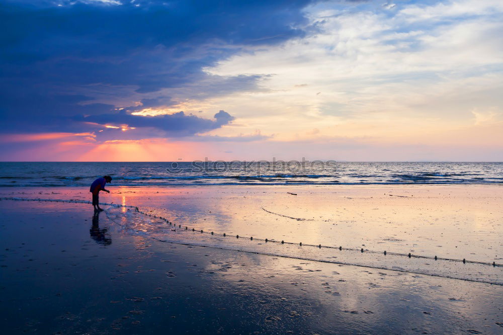 Similar – A sunset on a lonely beach