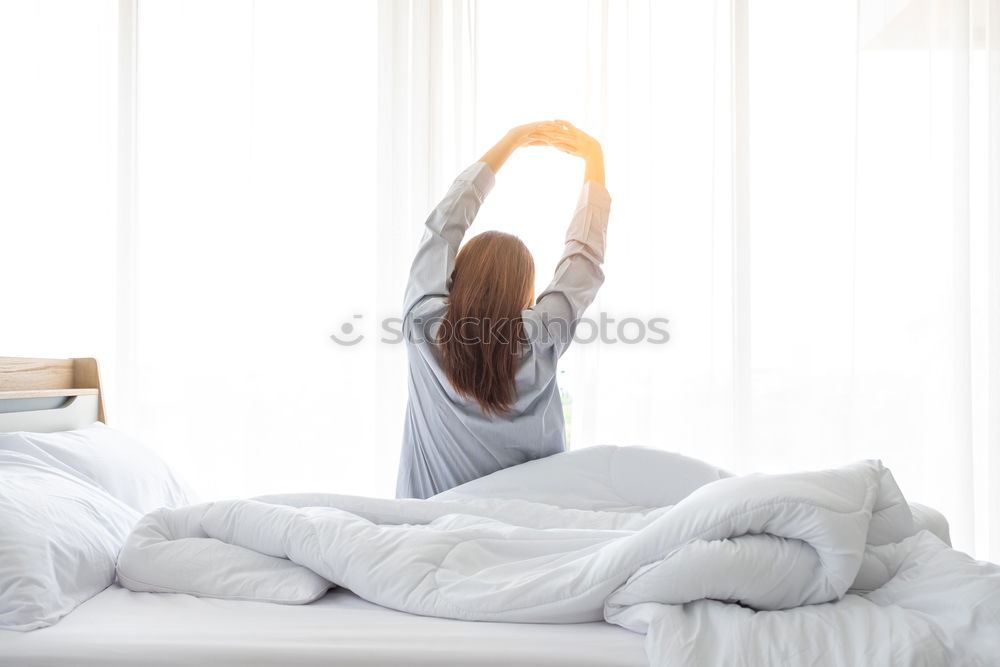 Similar – Image, Stock Photo Woman’s legs in bed on the white wall