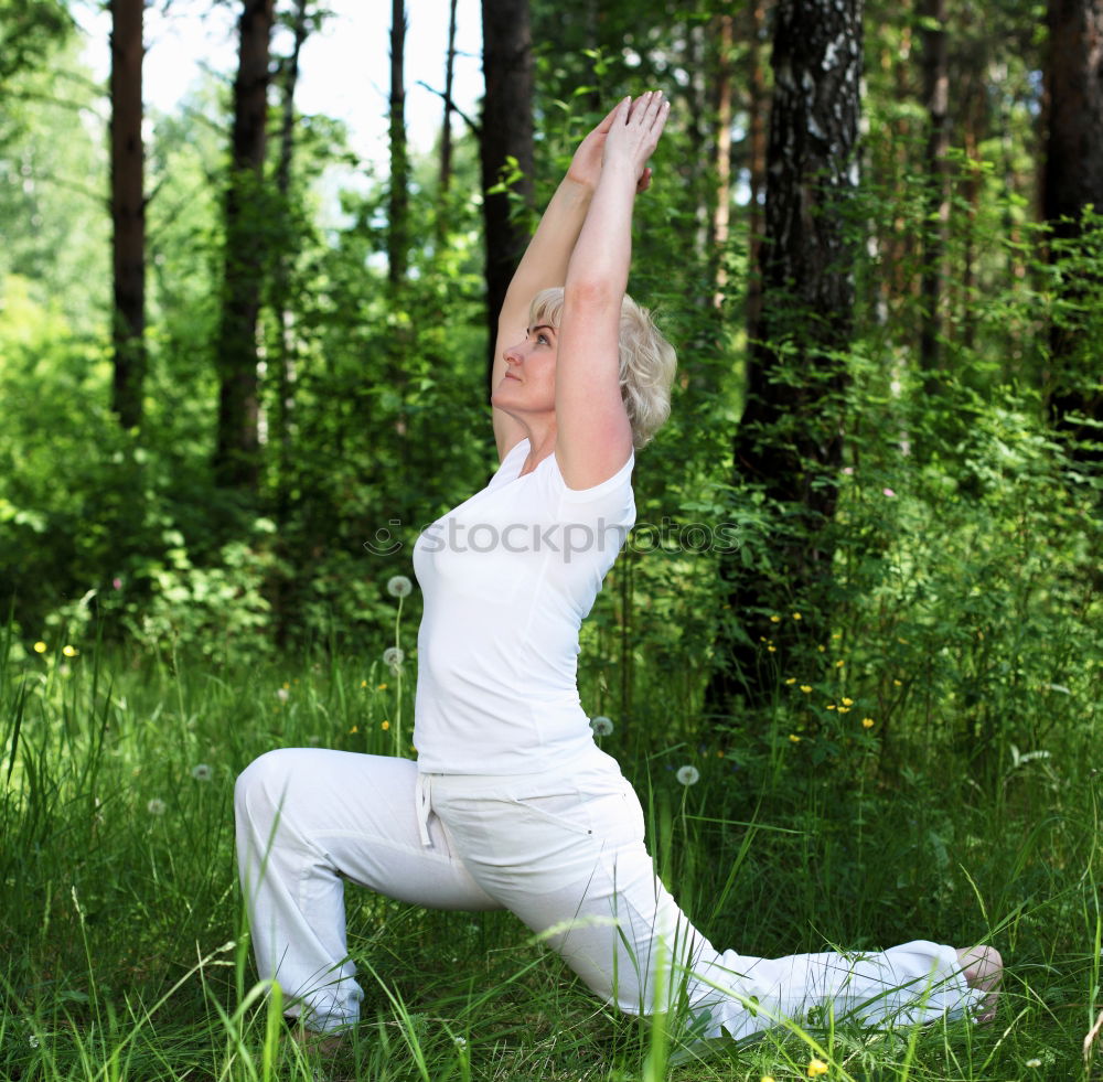 Similar – Image, Stock Photo Young woman doing yoga in nature.