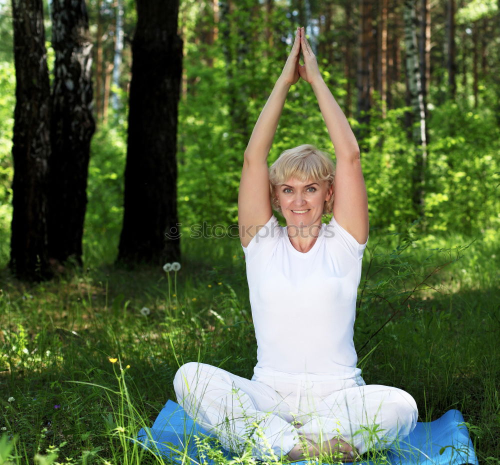 Similar – Young woman meditates in yoga asana Padmasana