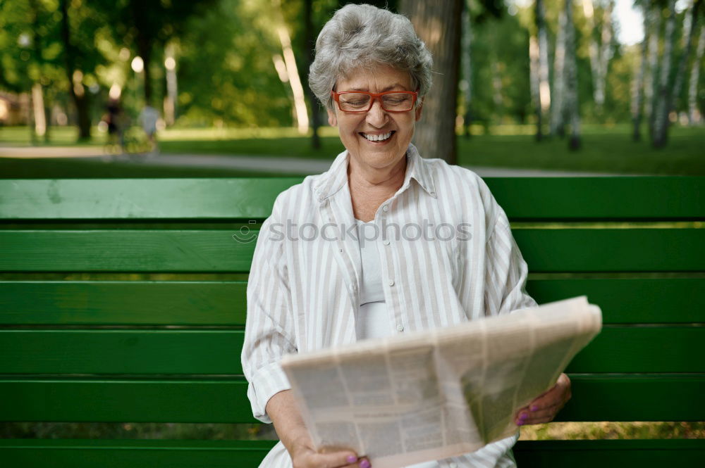 Similar – Image, Stock Photo Senior citizen looks at her smartphone in the autumn forest