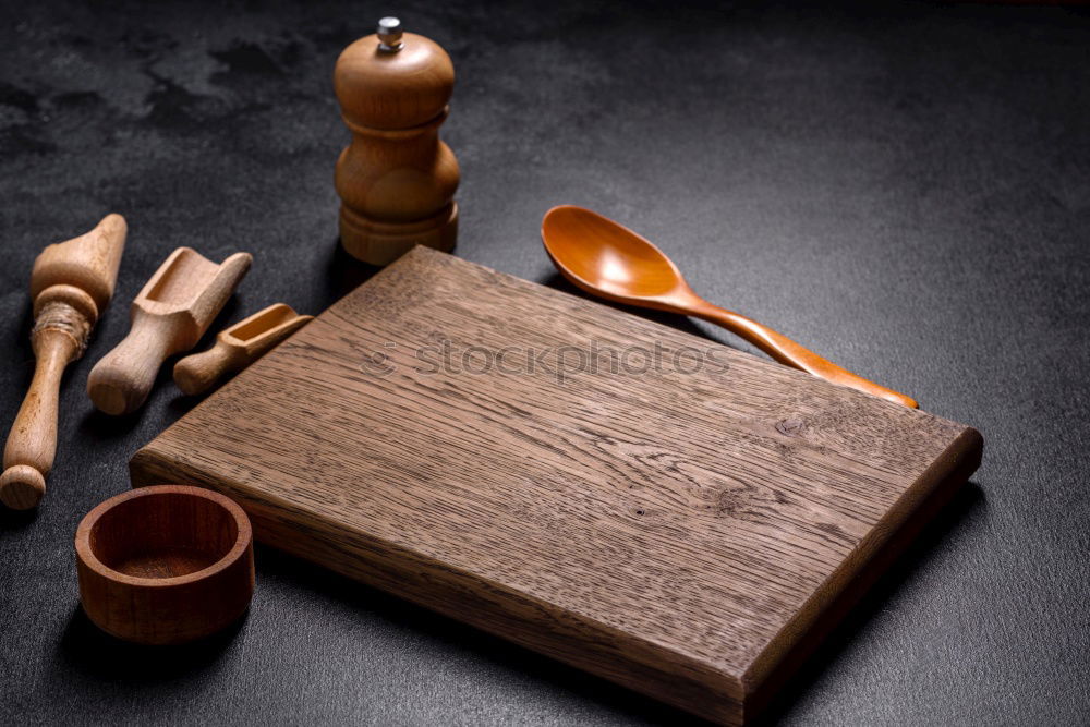 Similar – empty old brown wooden cutting board and spoon