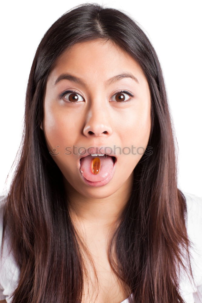 Similar – portrait of young woman eating bubble gum in brick background