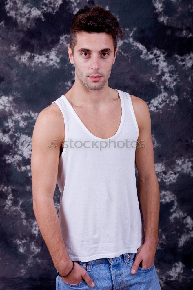 Similar – Young man standing in urban background with modern hairstyle.